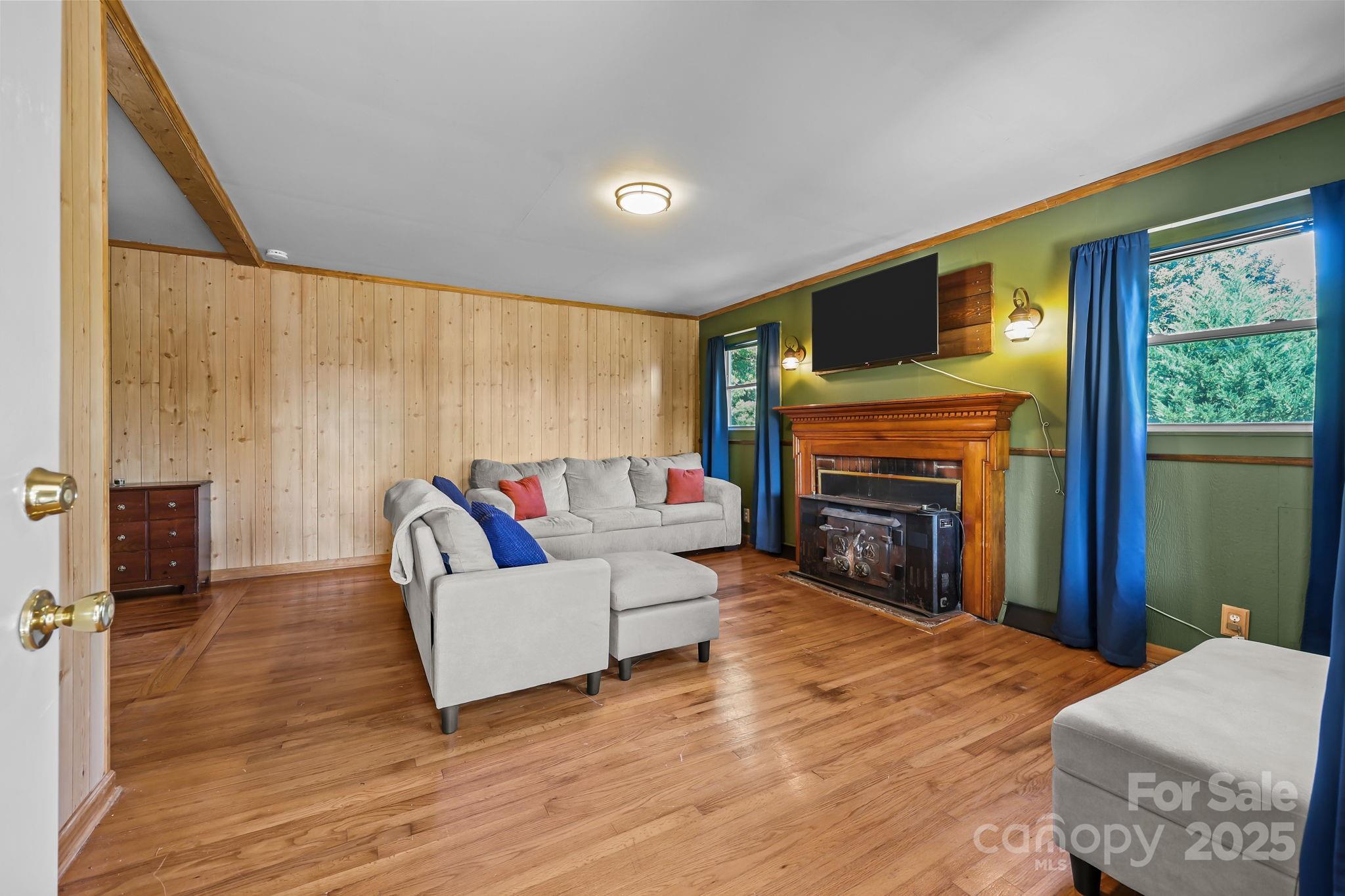 104 Pine Road Mount Holly, NC 28120 - Photo 4 of 46 a living room with furniture and a fireplace
