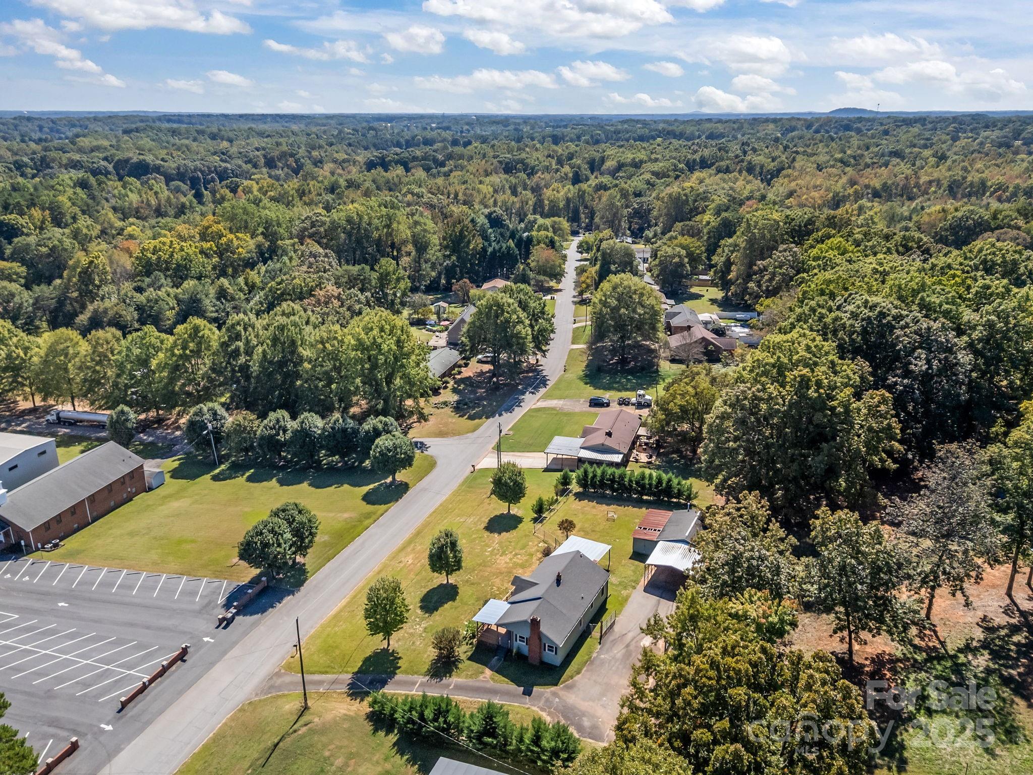 104 Pine Road Mount Holly, NC 28120 - Photo 42 of 46 an aerial view of house with yard swimming pool and outdoor seating
