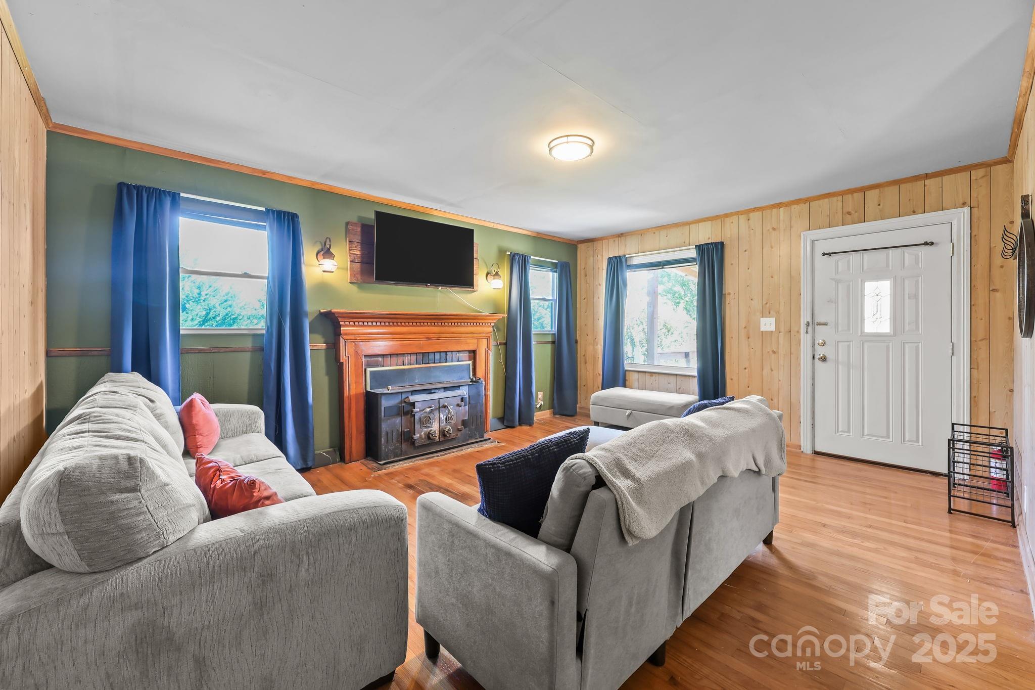 104 Pine Road Mount Holly, NC 28120 - Photo 5 of 46 a living room with furniture and a flat screen tv