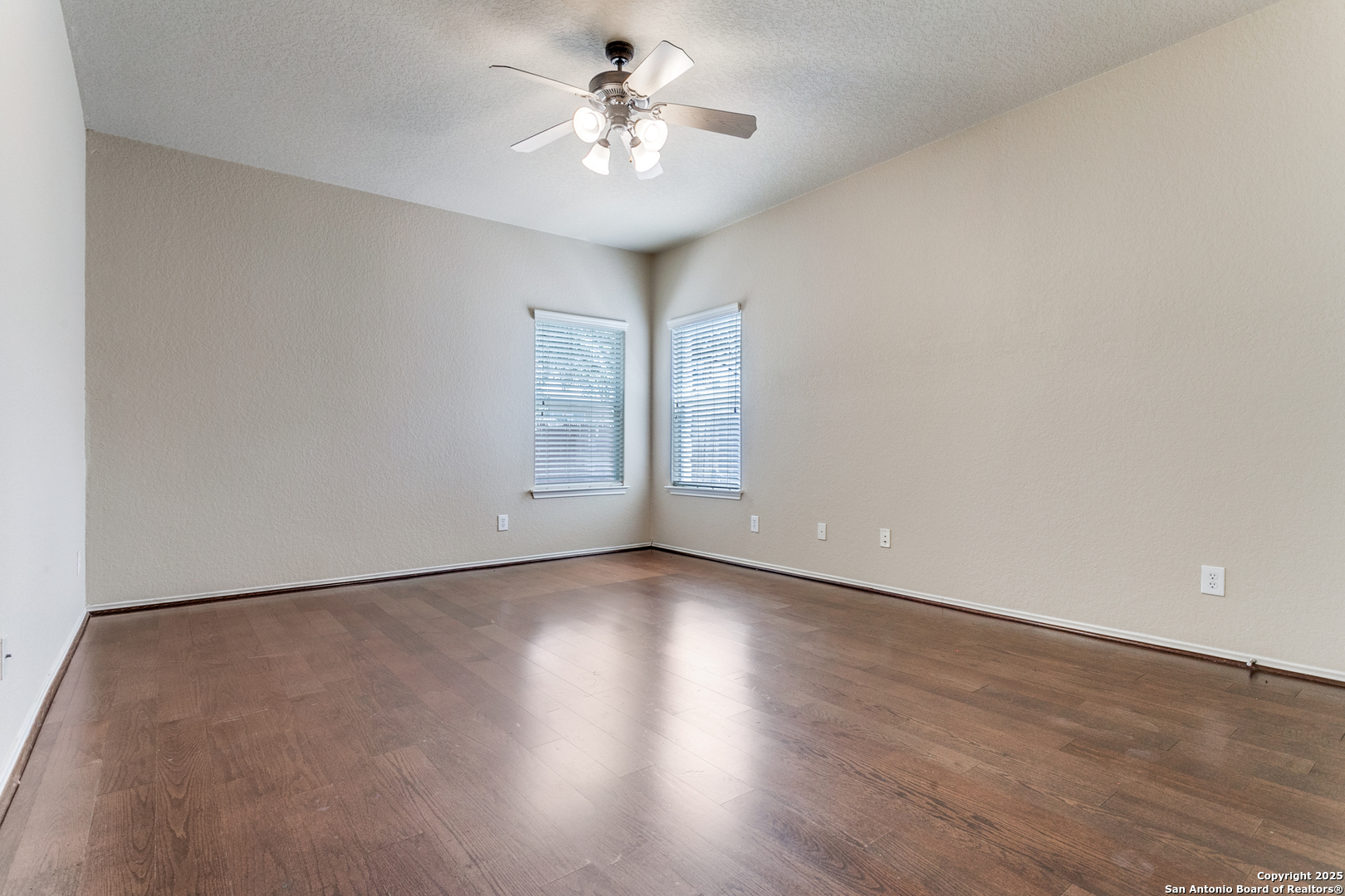 3418 Alonzo Fields Converse, TX 78109 - Photo 12 of 36 an empty room with wooden floor and window