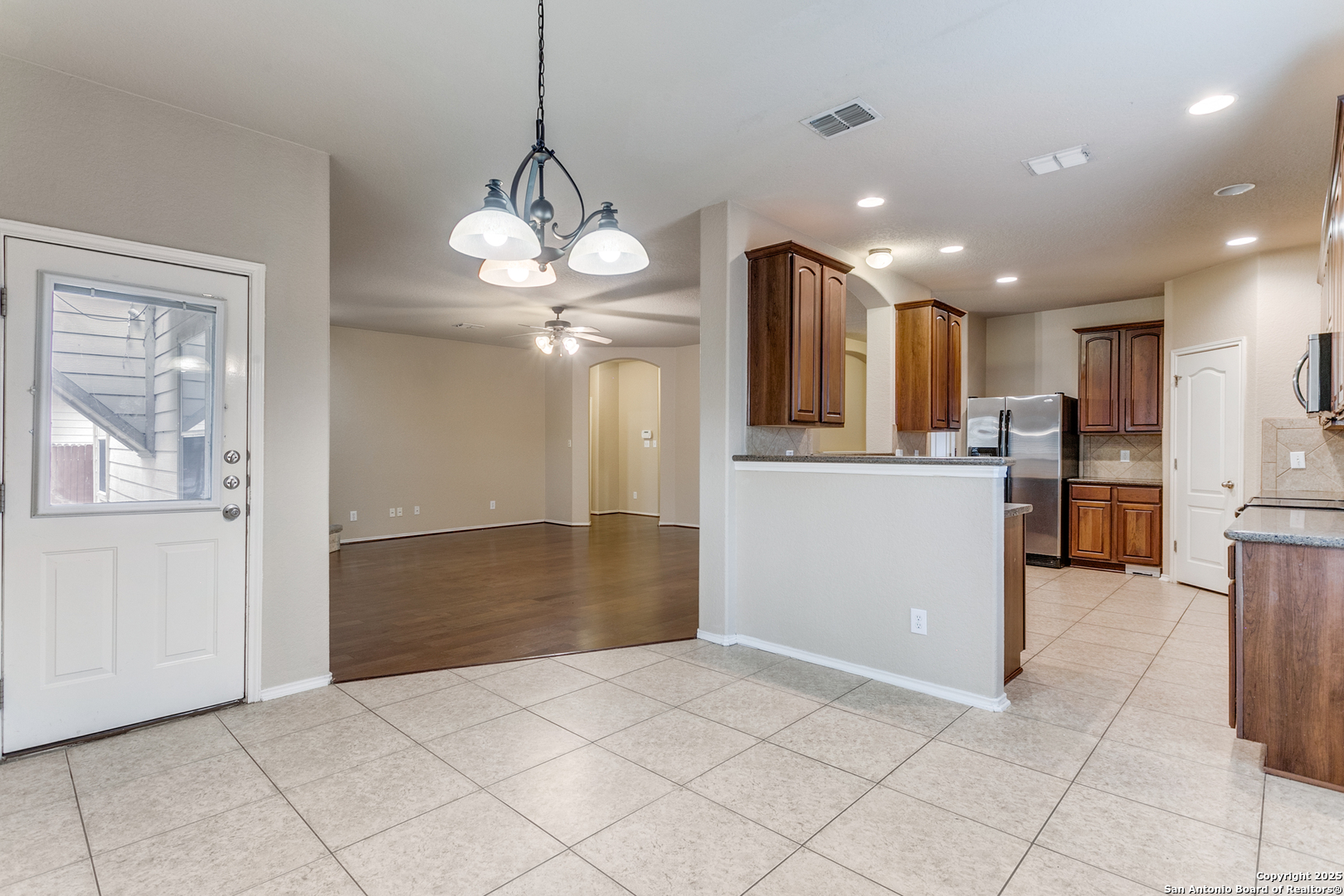 3418 Alonzo Fields Converse, TX 78109 - Photo 14 of 36 a view of a kitchen with a sink and refrigerator