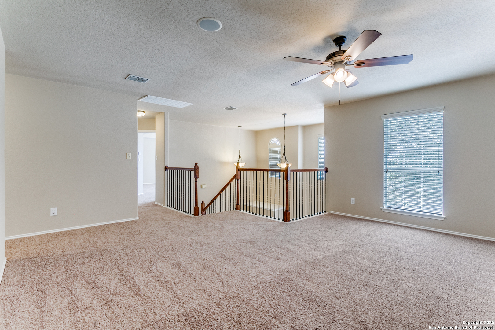 3418 Alonzo Fields Converse, TX 78109 - Photo 20 of 36 a view of an empty room with a chandelier fan