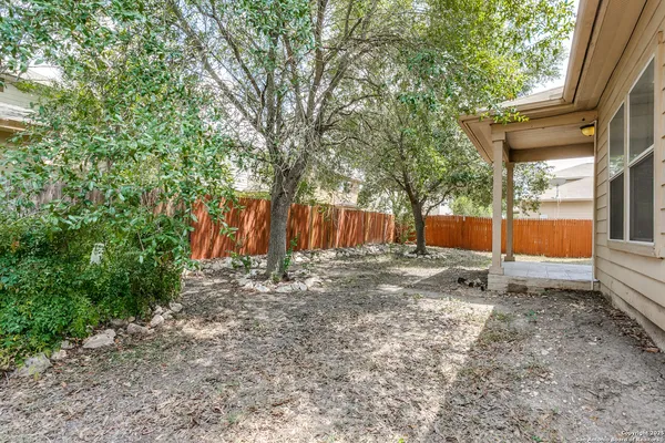 a backyard of a house with entertaining space