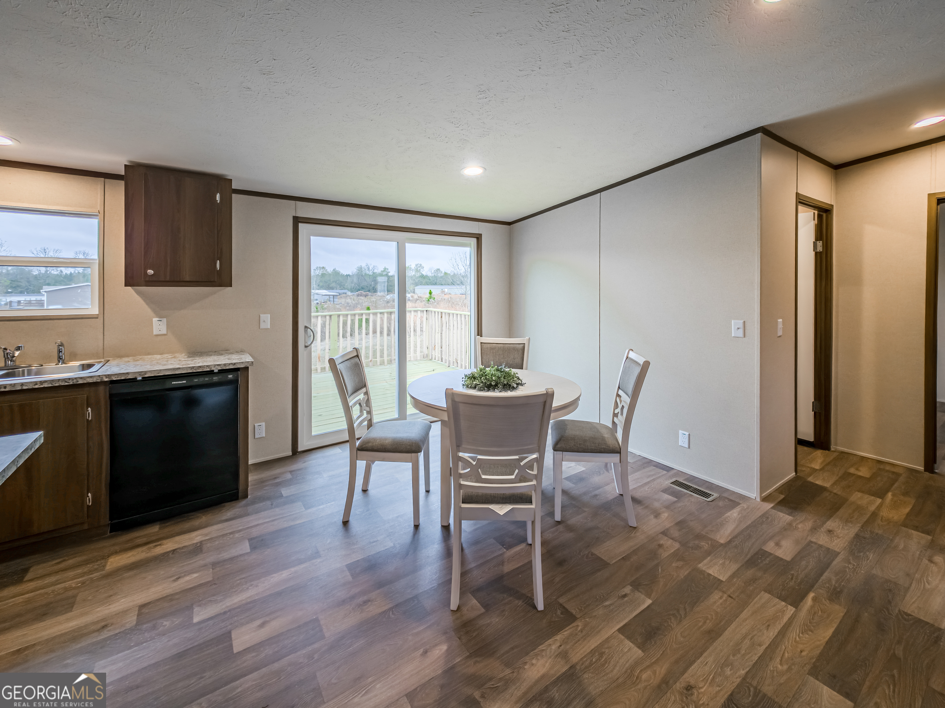 112 Courtney Circle Sumner, GA 31789 - Photo 13 of 32 a view of a dining room with furniture and wooden floor
