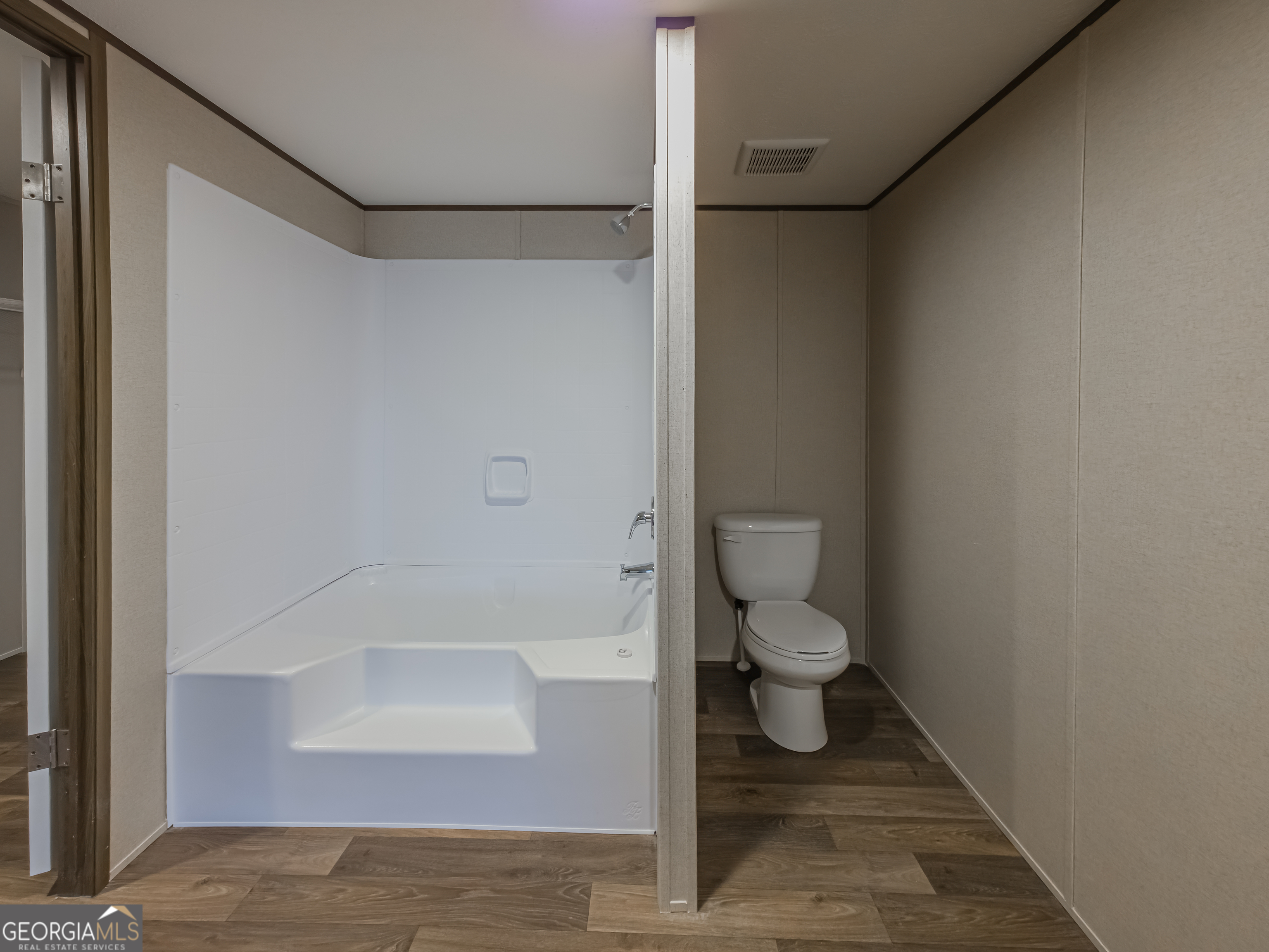 112 Courtney Circle Sumner, GA 31789 - Photo 21 of 32 a bathroom with a granite countertop toilet and a shower