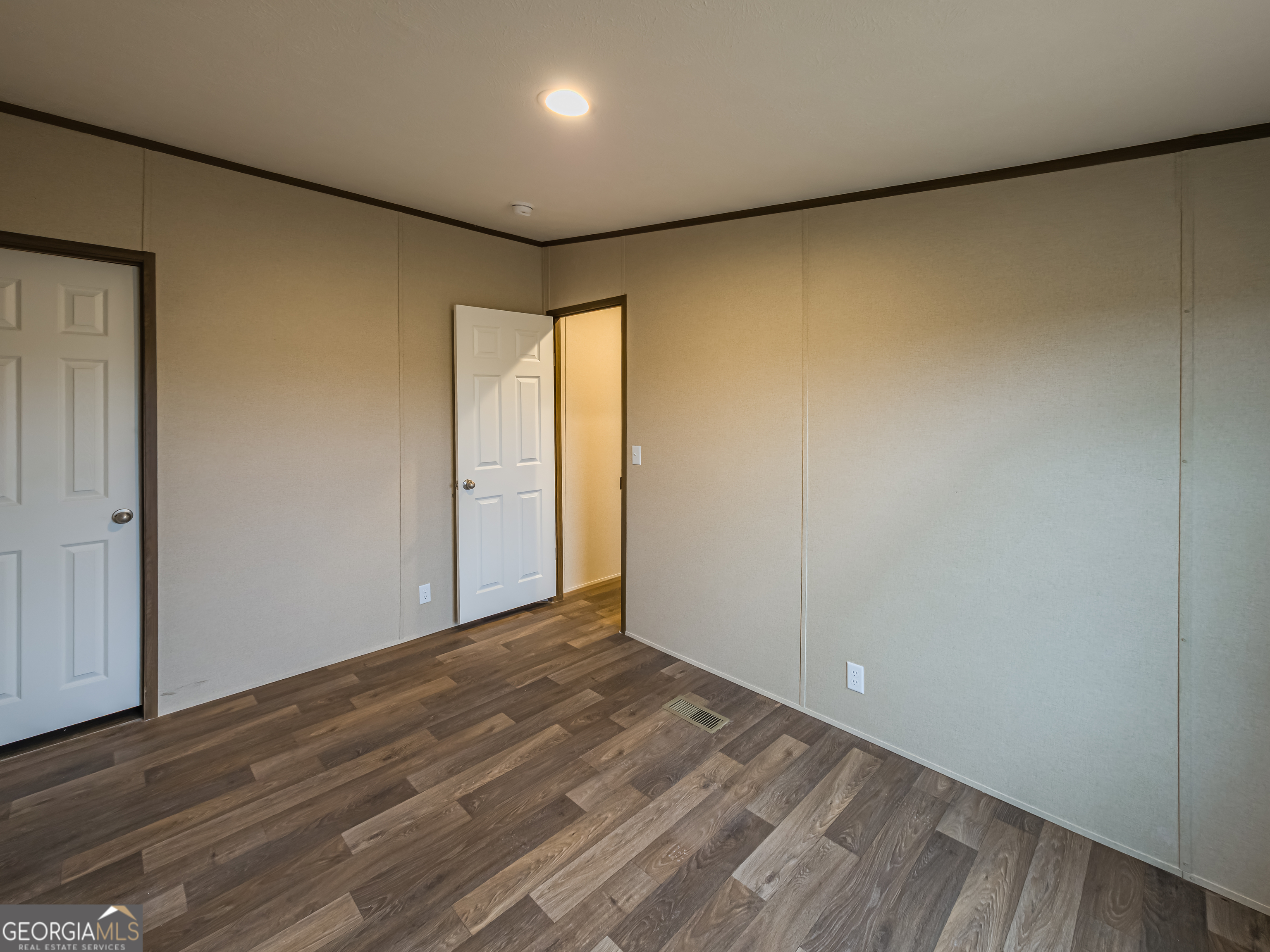 112 Courtney Circle Sumner, GA 31789 - Photo 28 of 32 a view of hallway with wooden floor