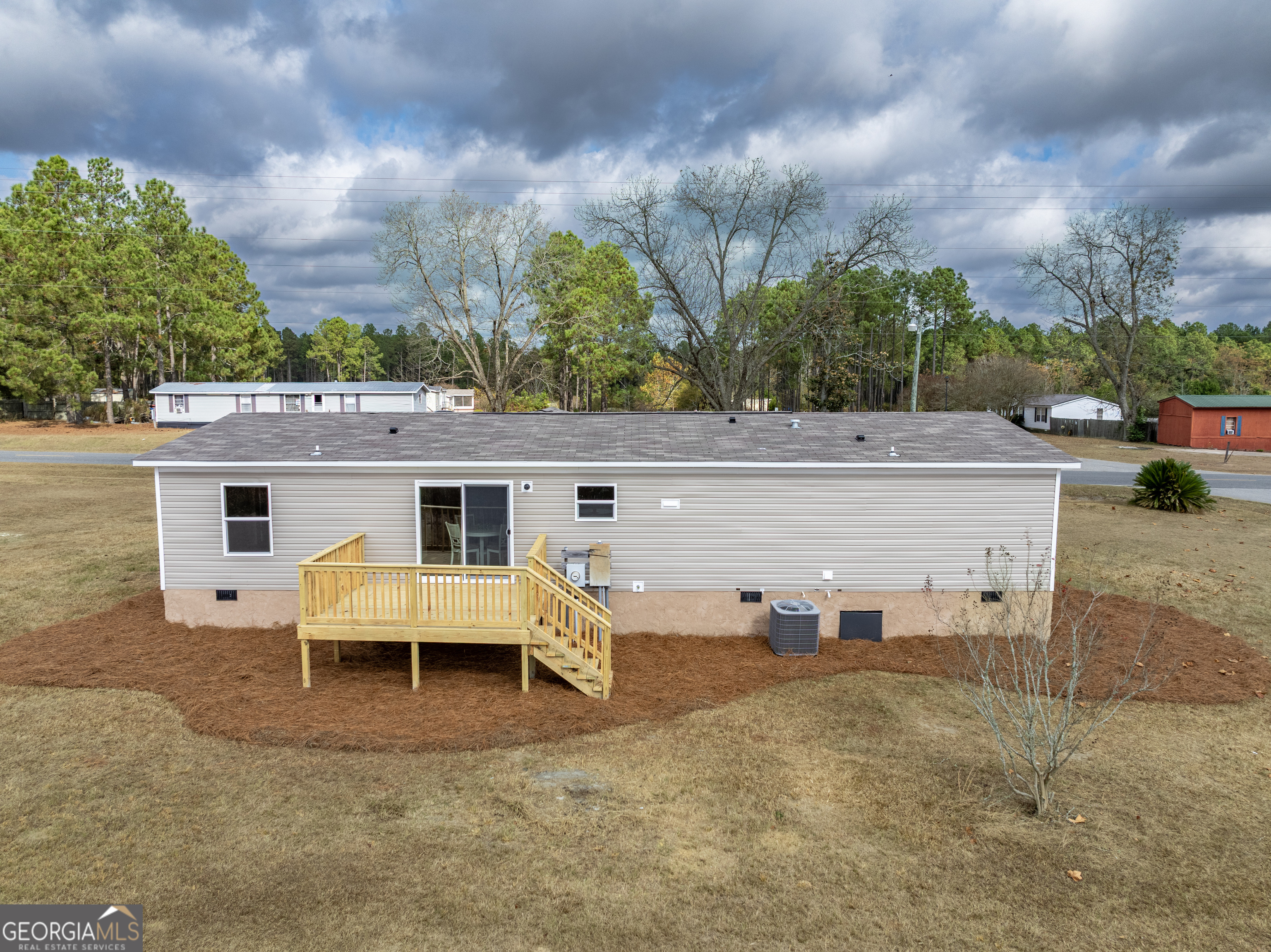 112 Courtney Circle Sumner, GA 31789 - Photo 31 of 32 a view of a house with backyard and sitting area