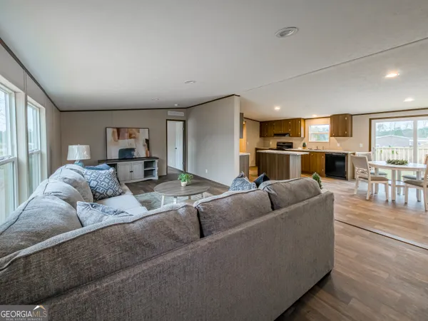 a living room with furniture and a table
