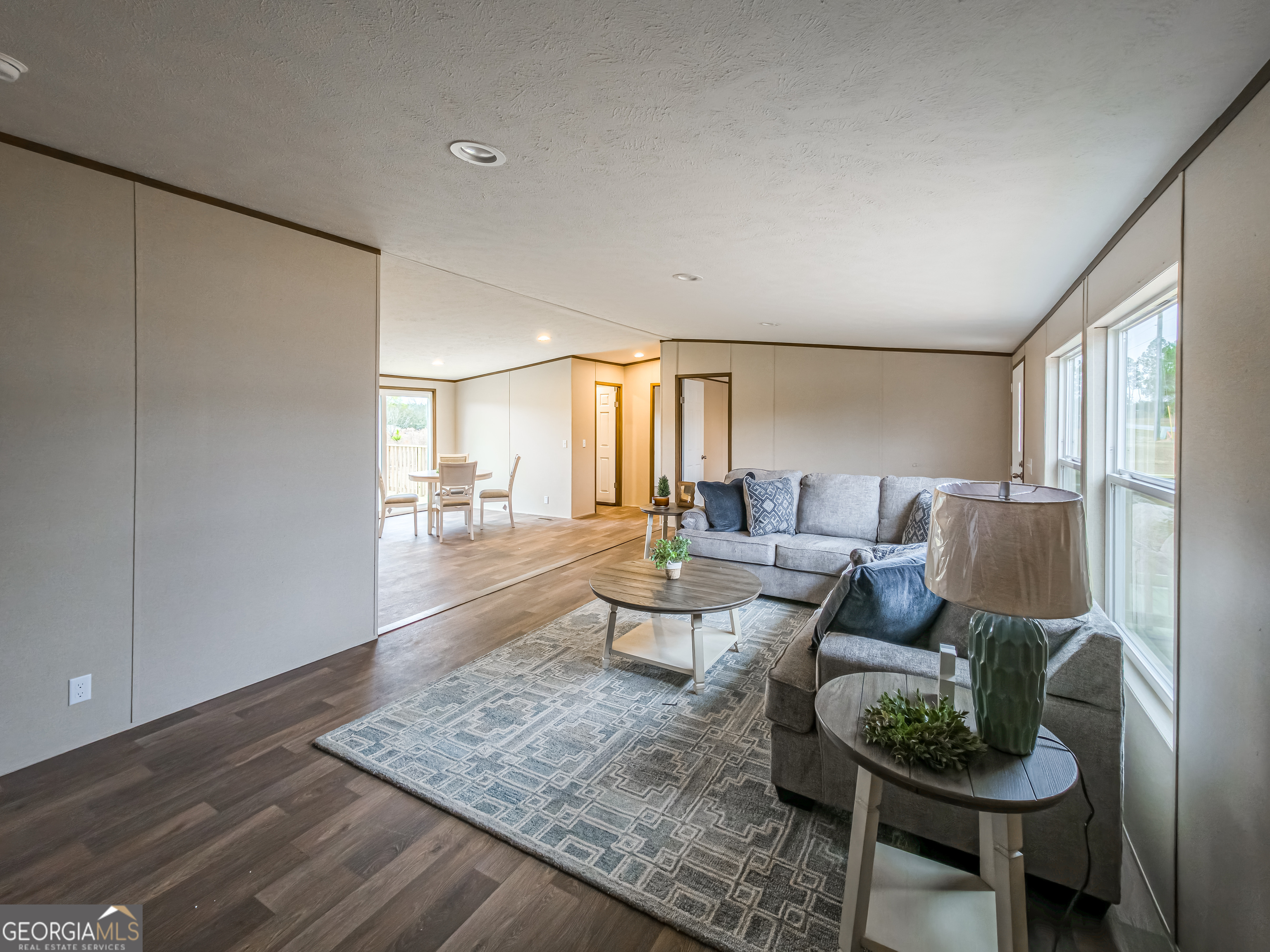 112 Courtney Circle Sumner, GA 31789 - Photo 7 of 32 a living room with furniture and a wooden floor