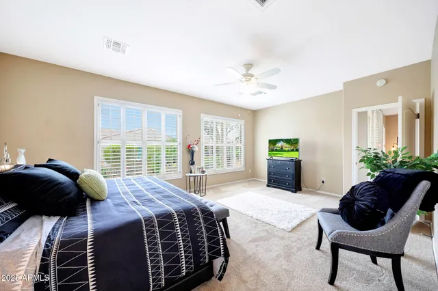a large bathroom with a double vanity sink mirror and shower