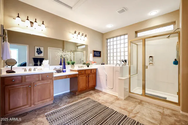 a bathroom with a sink vanity and mirror