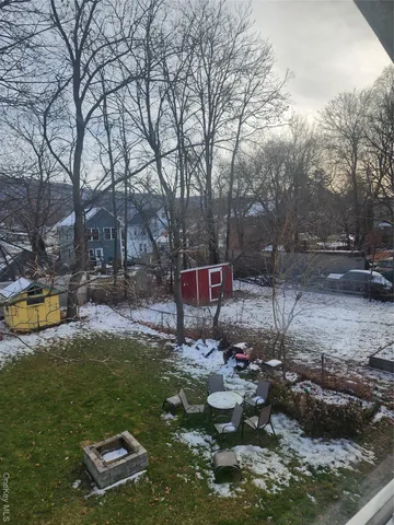 a view of a park with large trees