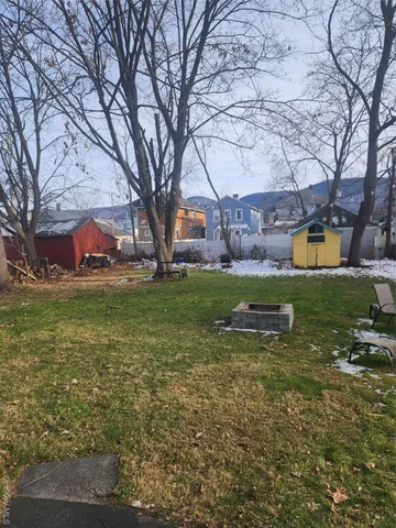 a backyard of a house with lots of green space