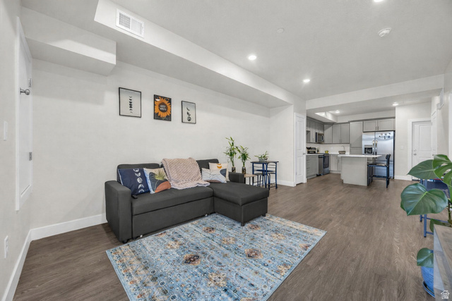 2101 North Main Street, Unit 409 Sunset, UT 84015 - Photo 7 of 18 Living area featuring recessed lighting and dark wood finished floors