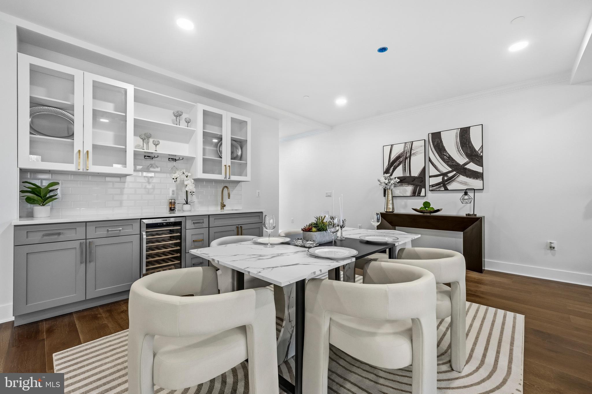 414 Waterford Road Silver Spring, MD 20901 - Photo 15 of 67 a kitchen with a dining table chairs and stove
