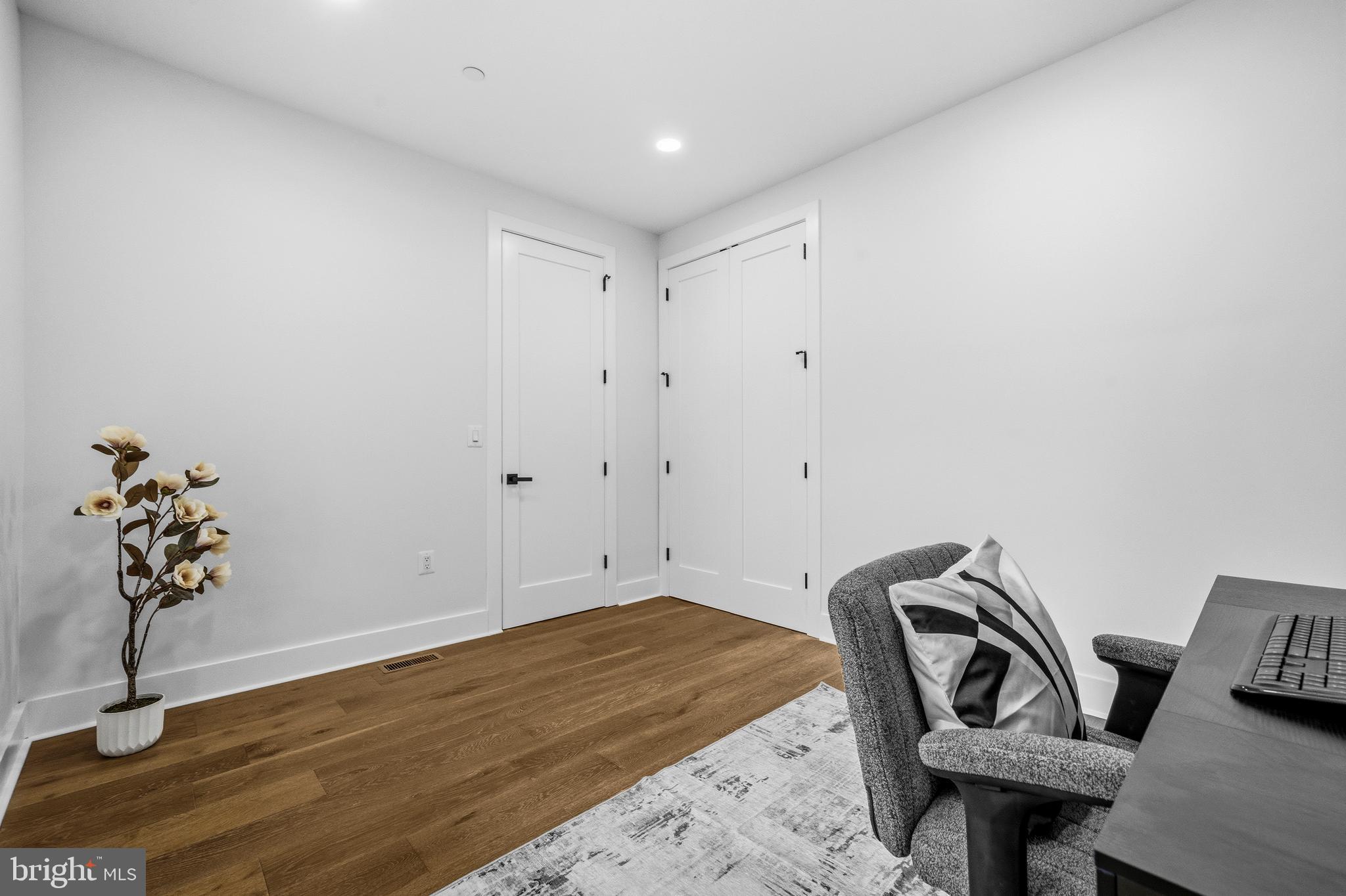 414 Waterford Road Silver Spring, MD 20901 - Photo 18 of 67 a view of a room with wooden floor and lounge chair
