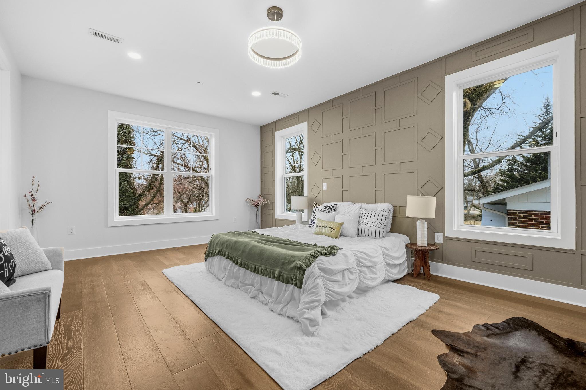 414 Waterford Road Silver Spring, MD 20901 - Photo 20 of 67 a spacious bedroom with a large bed and a window