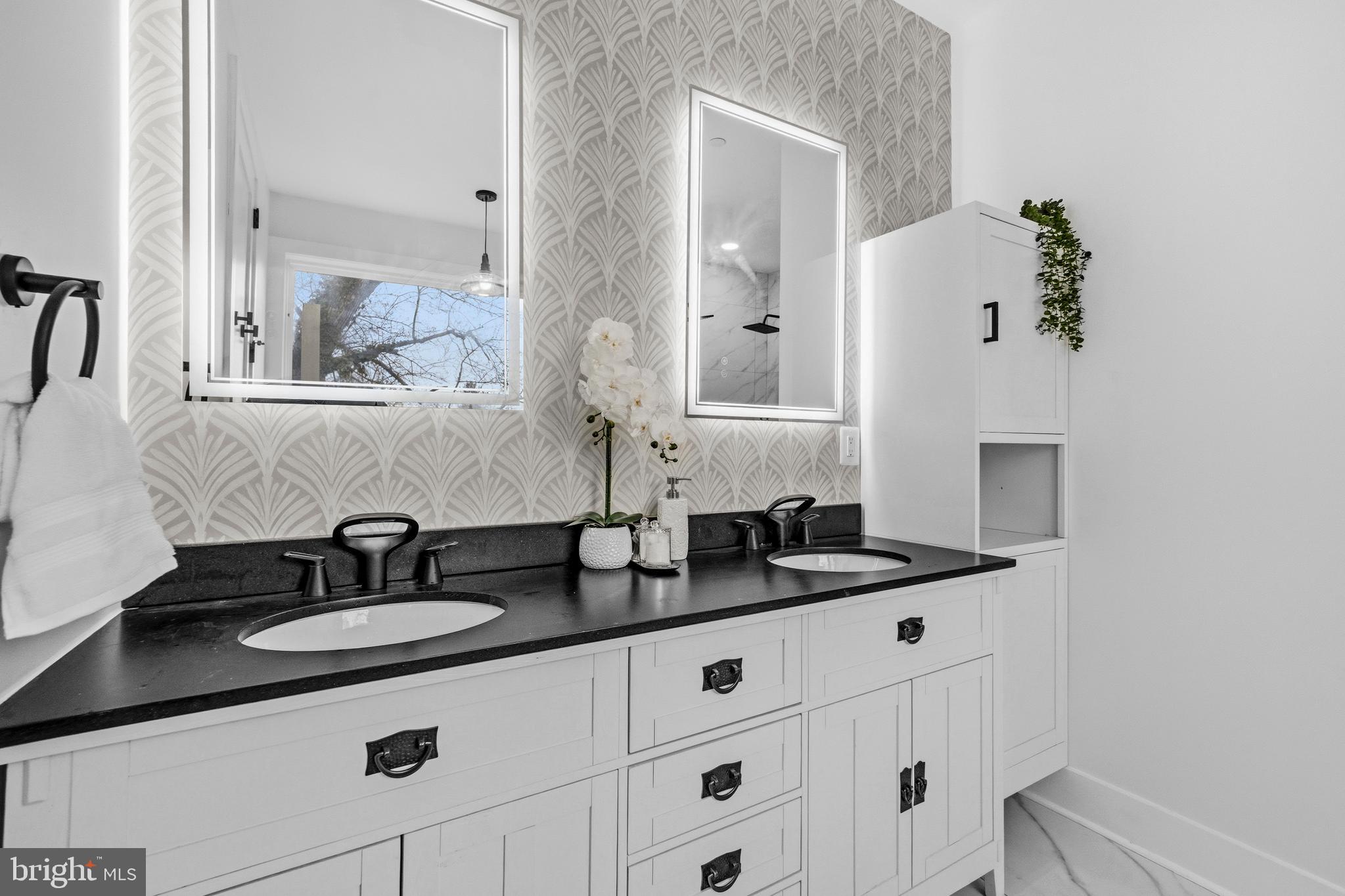 414 Waterford Road Silver Spring, MD 20901 - Photo 26 of 67 a bathroom with a sink and a mirror