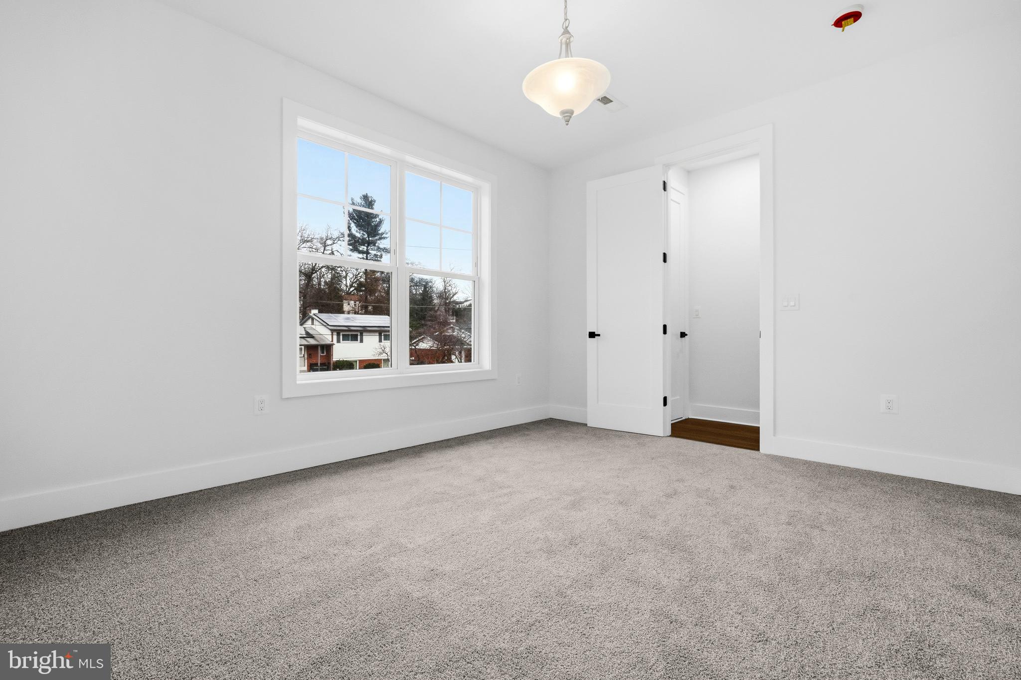 414 Waterford Road Silver Spring, MD 20901 - Photo 32 of 67 a view of an empty room with a window