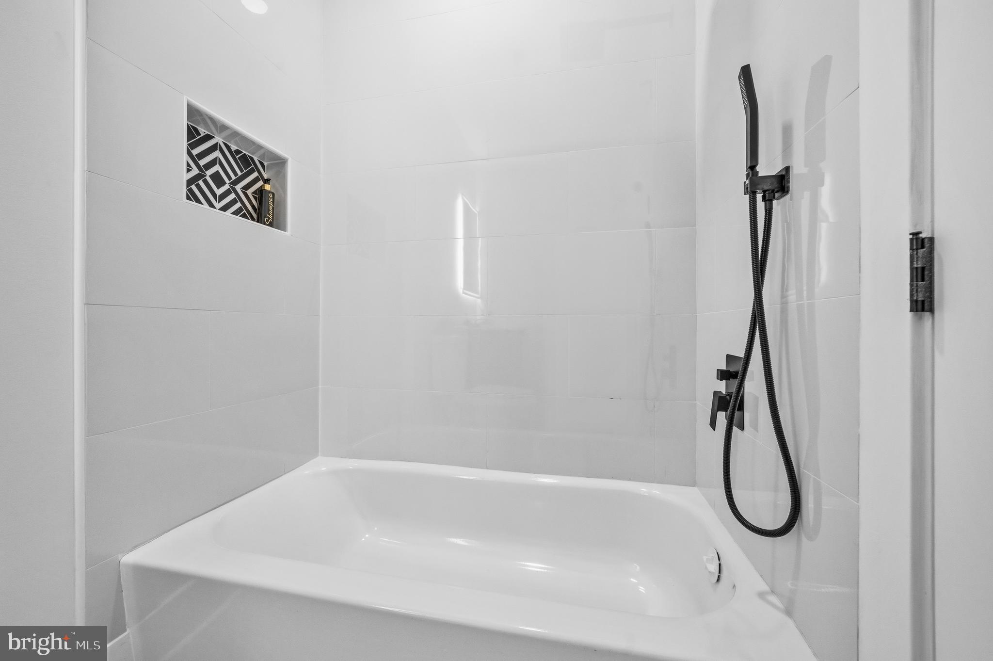 414 Waterford Road Silver Spring, MD 20901 - Photo 34 of 67 a bathroom with a bath tub with shower