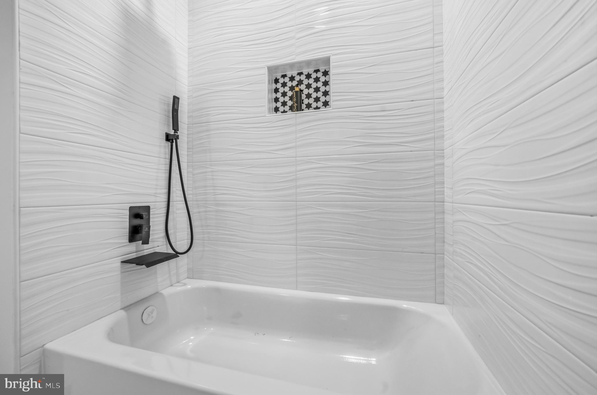 414 Waterford Road Silver Spring, MD 20901 - Photo 39 of 67 a bathroom with a bath tub