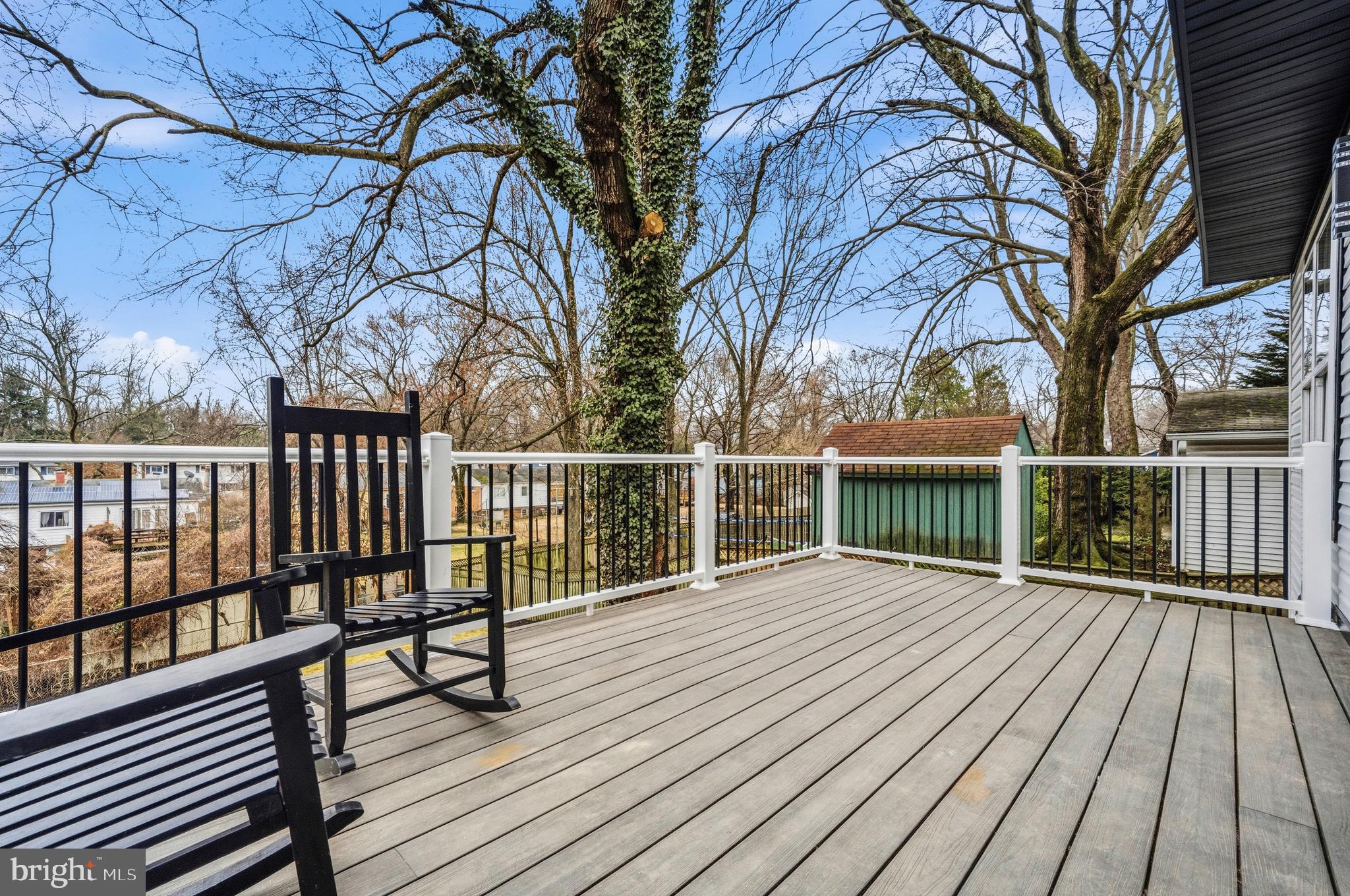 414 Waterford Road Silver Spring, MD 20901 - Photo 57 of 67 a view of a balcony with wooden floor and fence