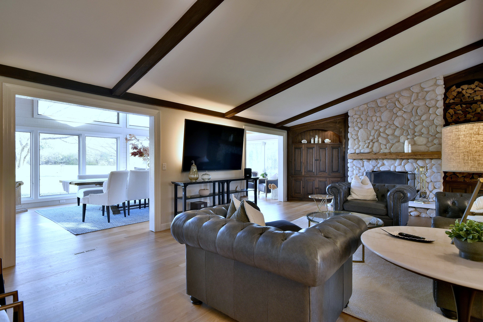 171 North Buckley Road Chicago, IL 60639 - Photo 16 of 42 a living room with fireplace furniture and a flat screen tv