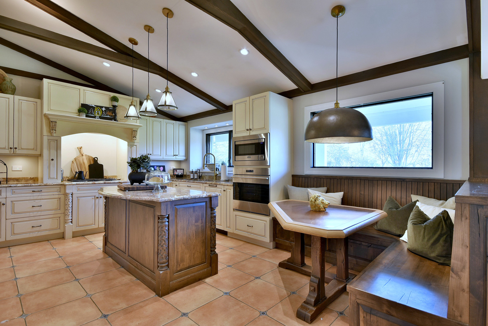 171 North Buckley Road Chicago, IL 60639 - Photo 20 of 42 a kitchen with stainless steel appliances kitchen island granite countertop a table chairs sink and cabinets