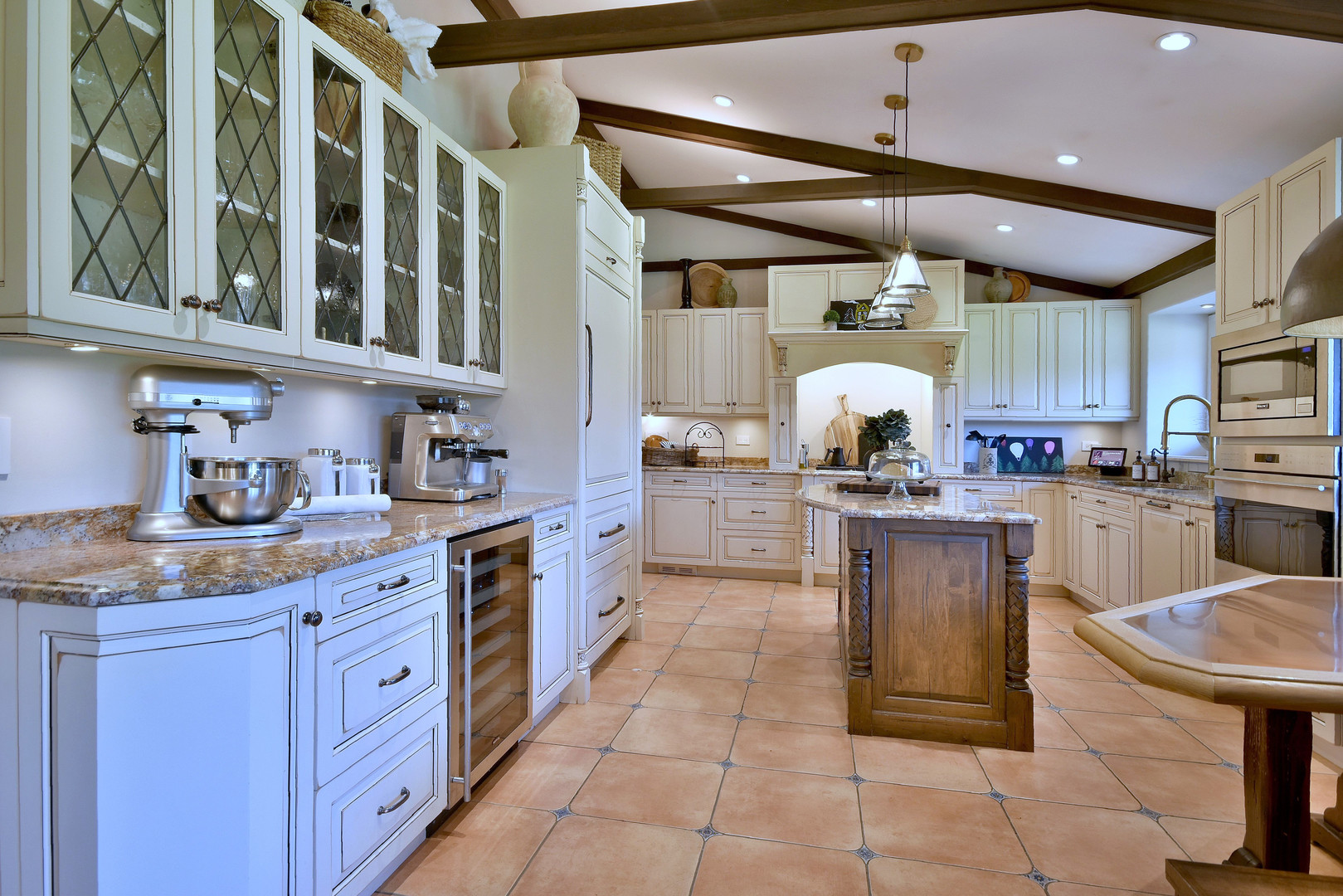 171 North Buckley Road Chicago, IL 60639 - Photo 21 of 42 a kitchen with cabinets and chairs