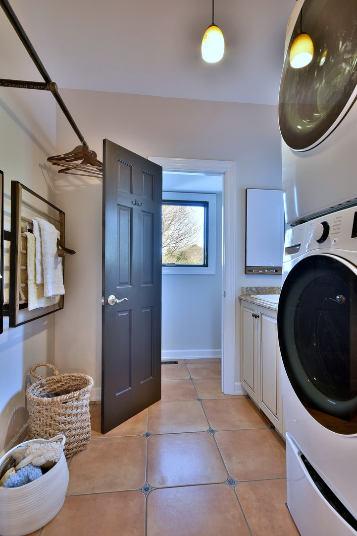 171 North Buckley Road Chicago, IL 60639 - Photo 25 of 42 a view of a hallway with washer and dryer