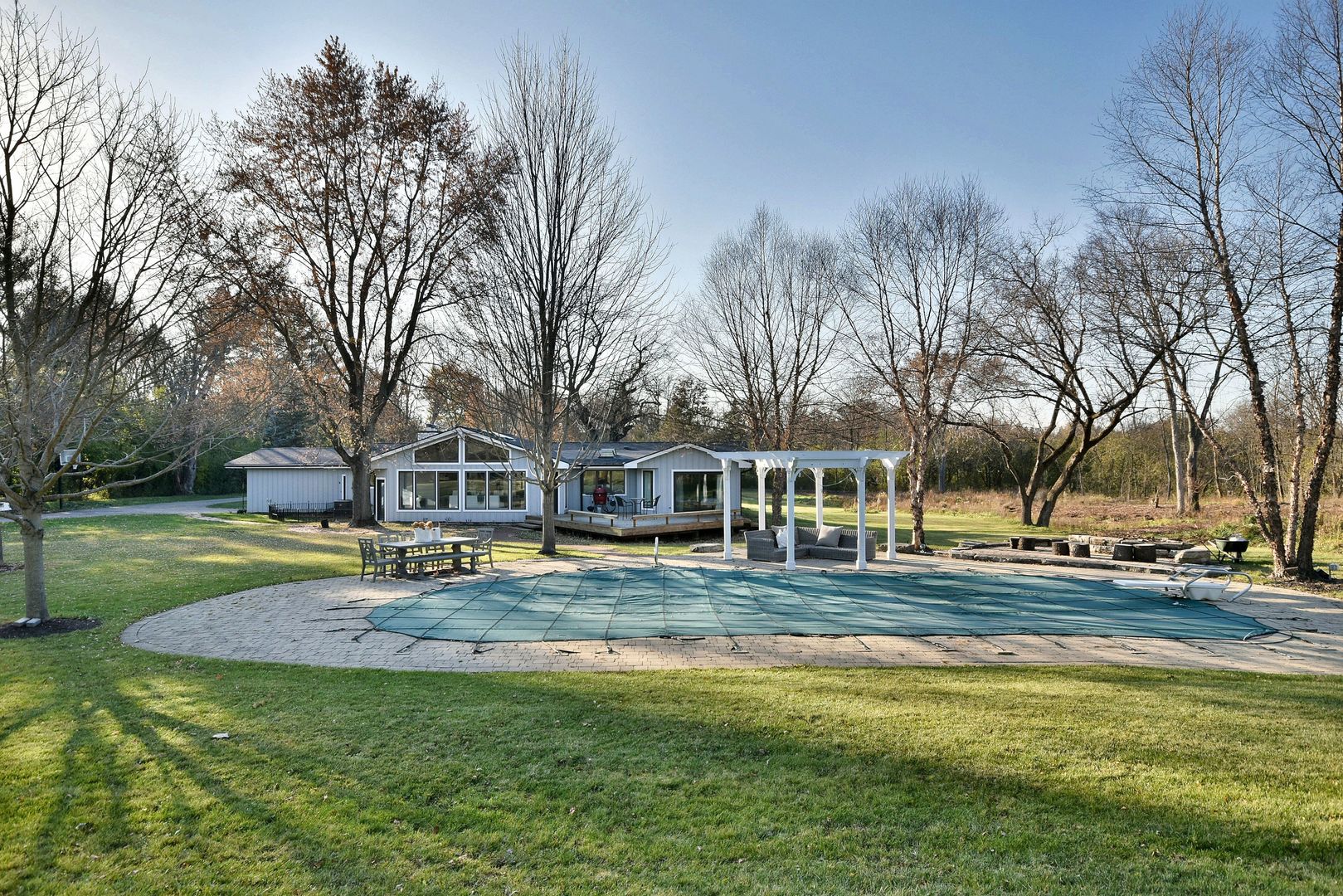 171 North Buckley Road Chicago, IL 60639 - Photo 6 of 42 a view of a house with a big yard and large trees