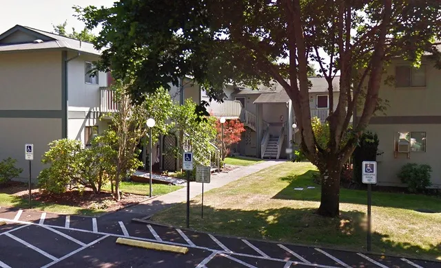 a view of a backyard with sitting area