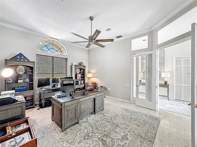 a living room with furniture a rug and a window