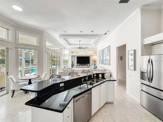 a kitchen with a sink a stove and refrigerator