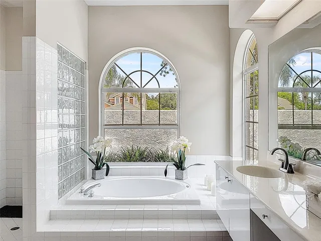 a bath tub sitting next to a window