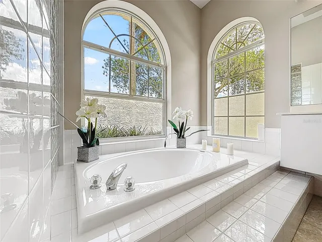 a bath tub sitting next to a window