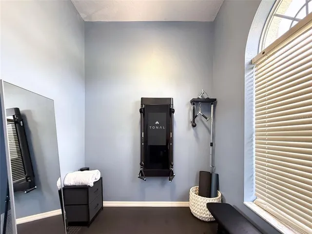 a dining room with furniture a chandelier and a rug