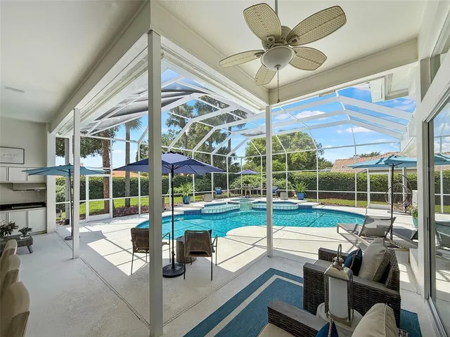 a view of a patio with a table and chairs