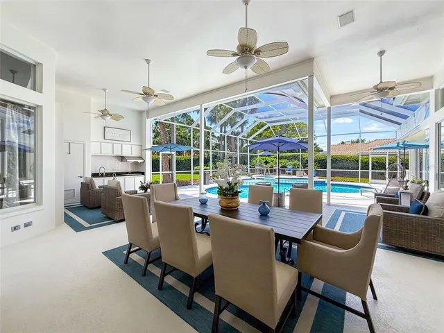 a view of a dining room with furniture wooden floor and chandelier
