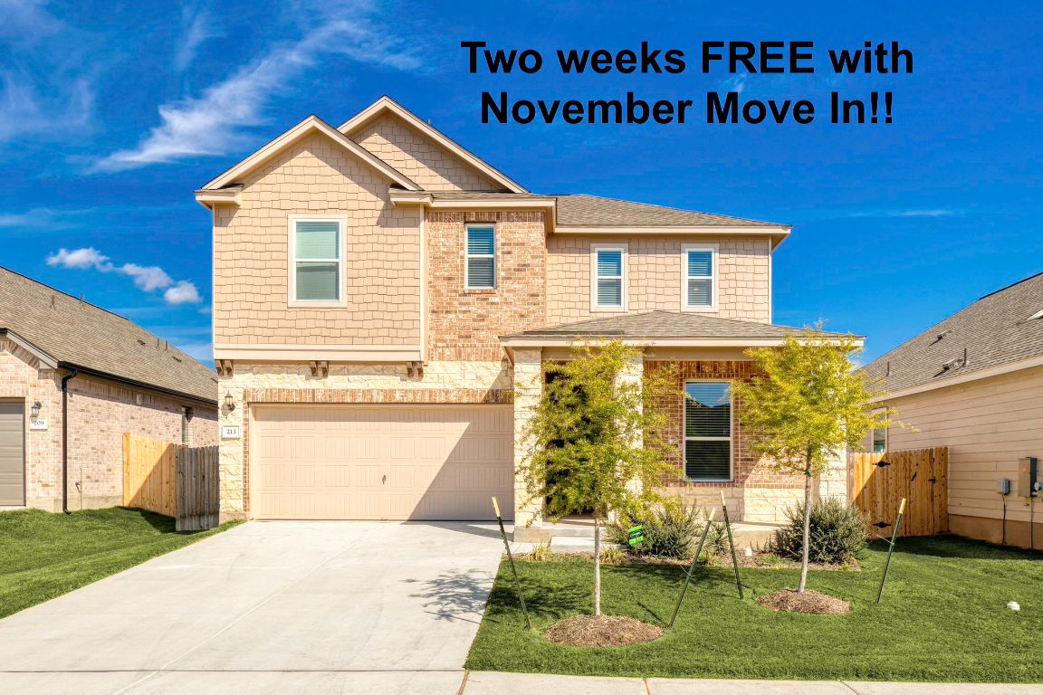 213 Skipping Stone Run Georgetown, TX 78628 - Photo 1 of 31 a front view of a house with a yard