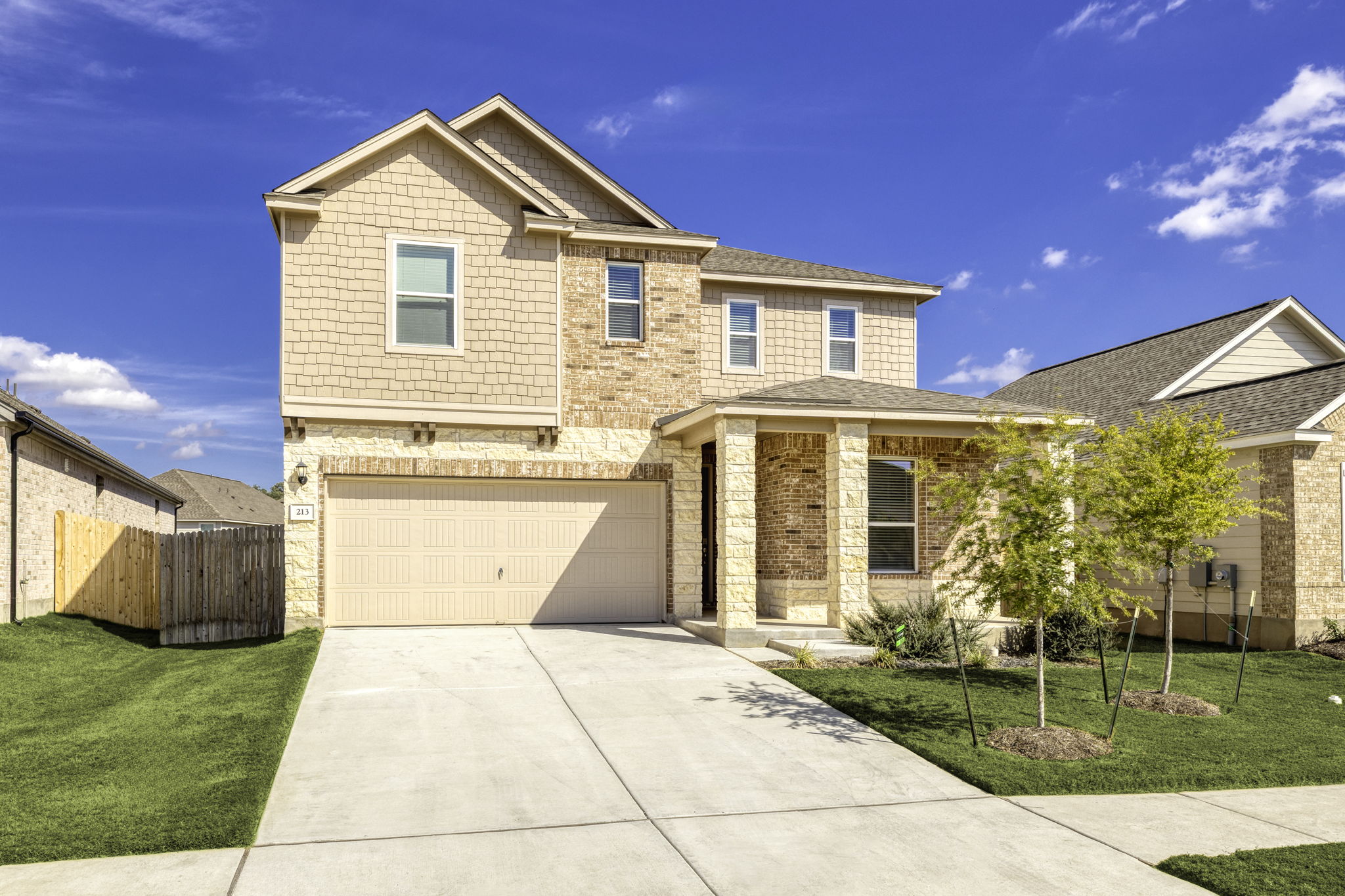 a view of a house with many windows and yard