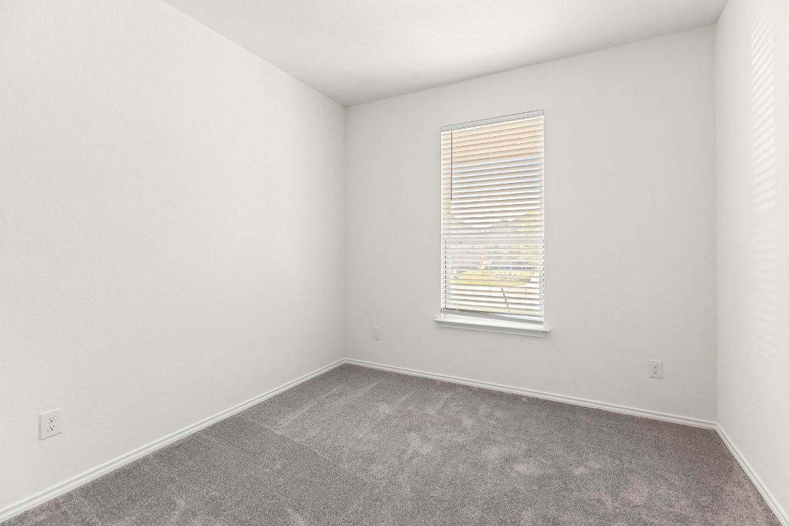 213 Skipping Stone Run Georgetown, TX 78628 - Photo 12 of 31 an empty room with a window