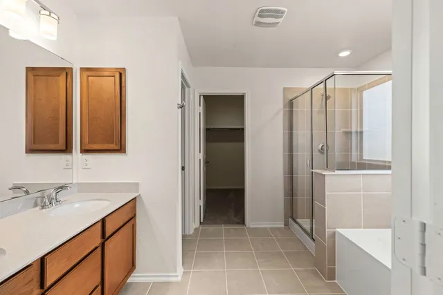 a bathroom with a sink double vanity and a mirror