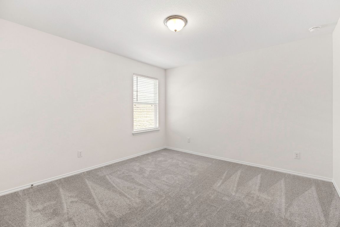 213 Skipping Stone Run Georgetown, TX 78628 - Photo 22 of 31 an empty room with a window