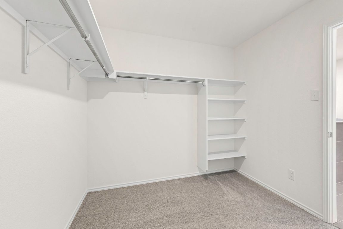 213 Skipping Stone Run Georgetown, TX 78628 - Photo 25 of 31 a view of an empty walk in closet