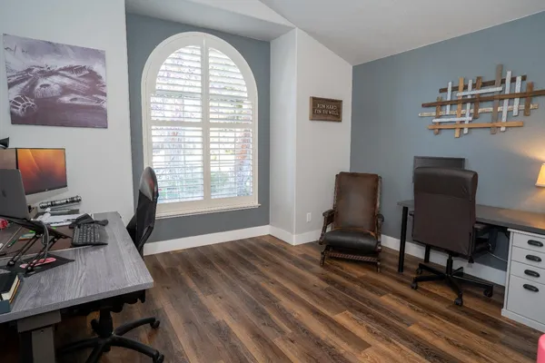 a workspace with furniture and a window