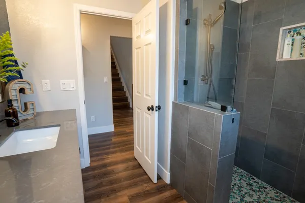 a bathroom with a sink and shower