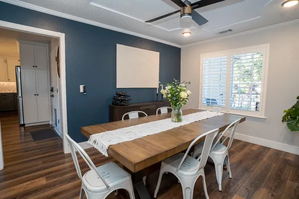 a view of a dining room with furniture window and wooden floor