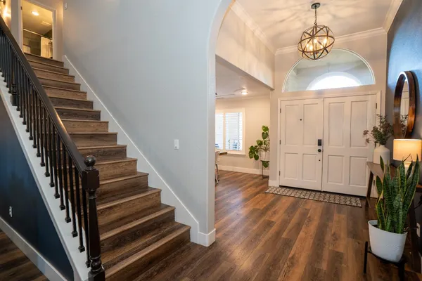 a view of an entryway with wooden floor