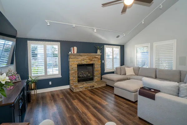 a living room with furniture and a fireplace
